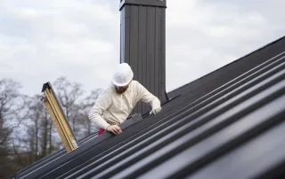 Greater Austin Roofing in Austin, Texas - Medium-shot-man-working-roof